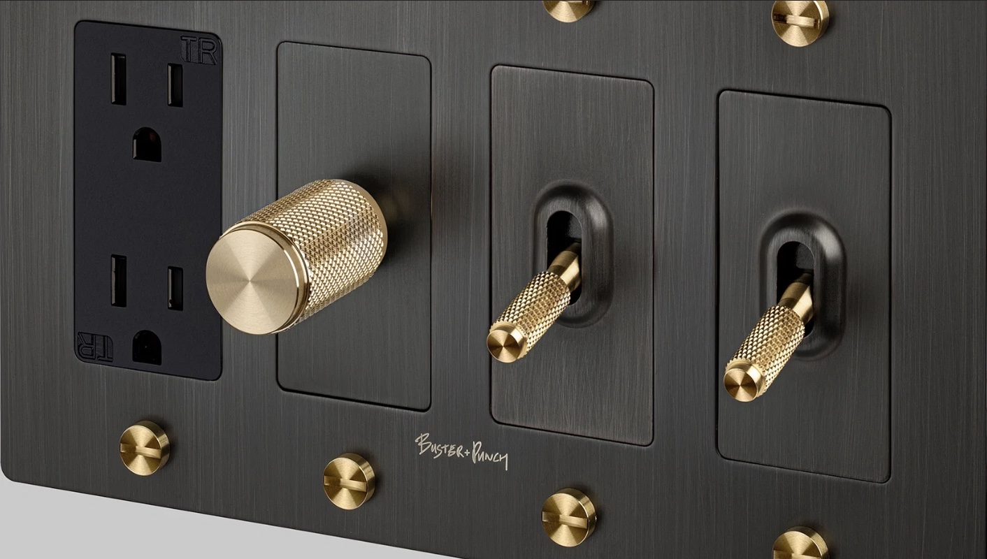 Buster and Punch custom black electrical plate with brass knurled controls and outlets