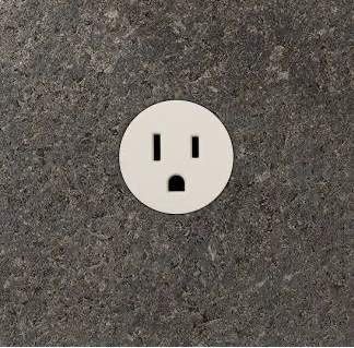 Prado unifit single 15 amp outlet in Sand installed in dark stone