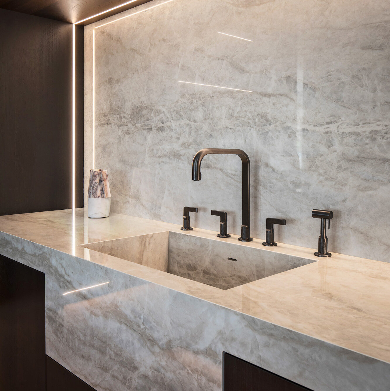 Continuous matching stone apron-front sink